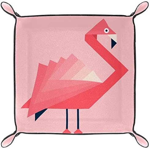 Flamingos u geometrijskom pladanju za umjetničkoj osovini na radnoj površini, pladanj za ispraznosti, organizator
